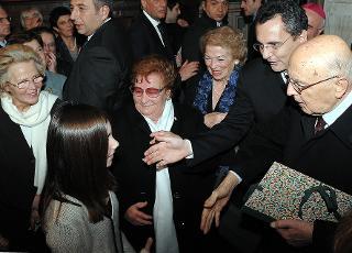 Il Presidente Napolitano con la moglie Clio e Marco Impagliazzo durante la visita alla Comunità di Sant'Egidio.